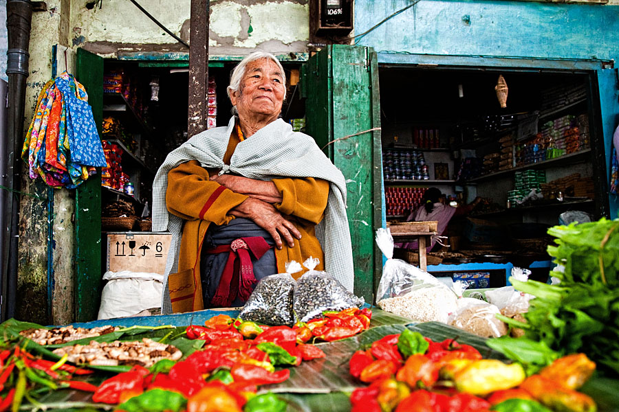  Market woman selling delicatessen at the local market of Kohima
